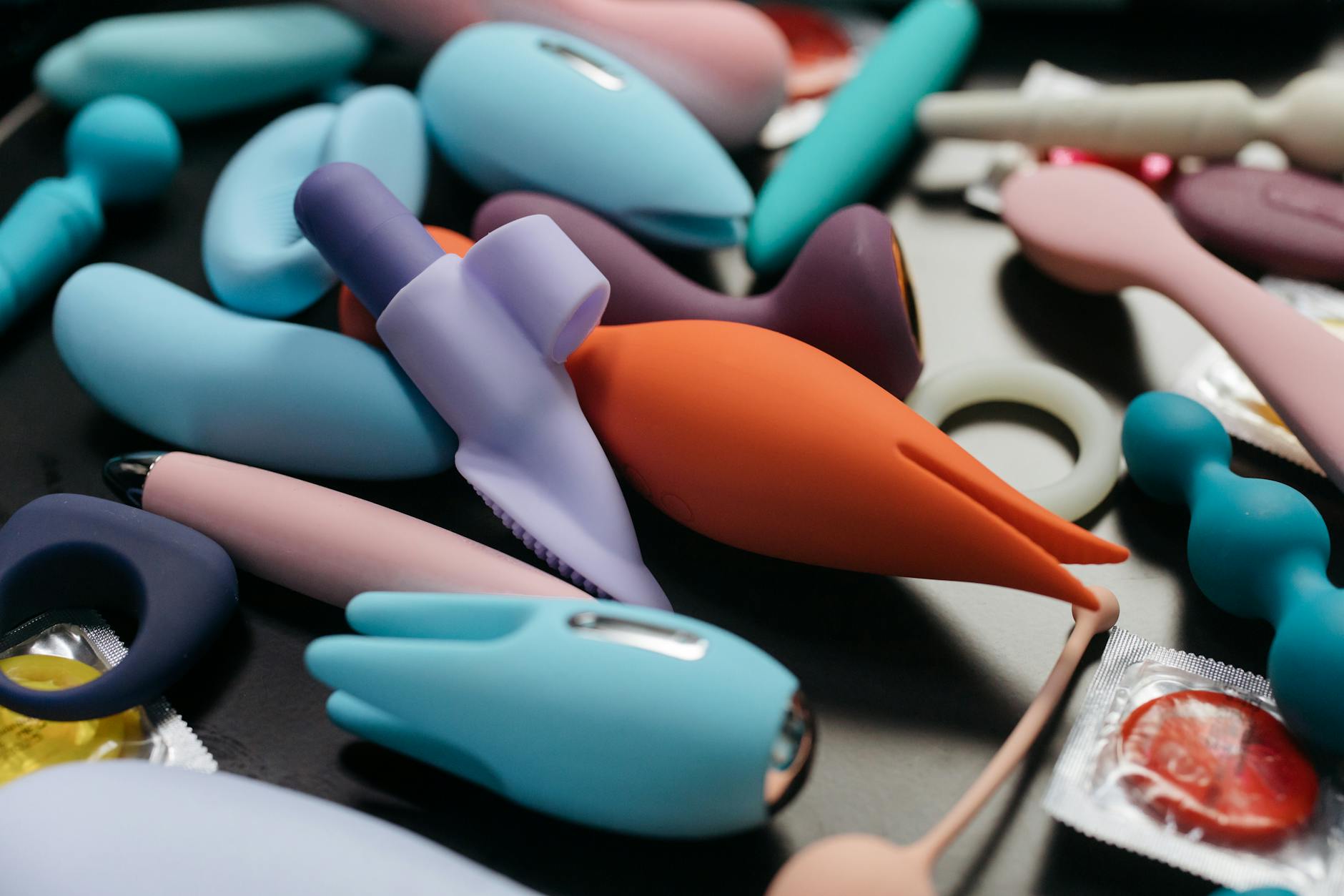 A collection of colorful lemon clitoral vibrators and adult toys displayed together